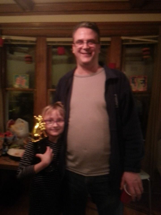 Fuzzy picture of extraordinarily happy chili cook-off winner and his helper